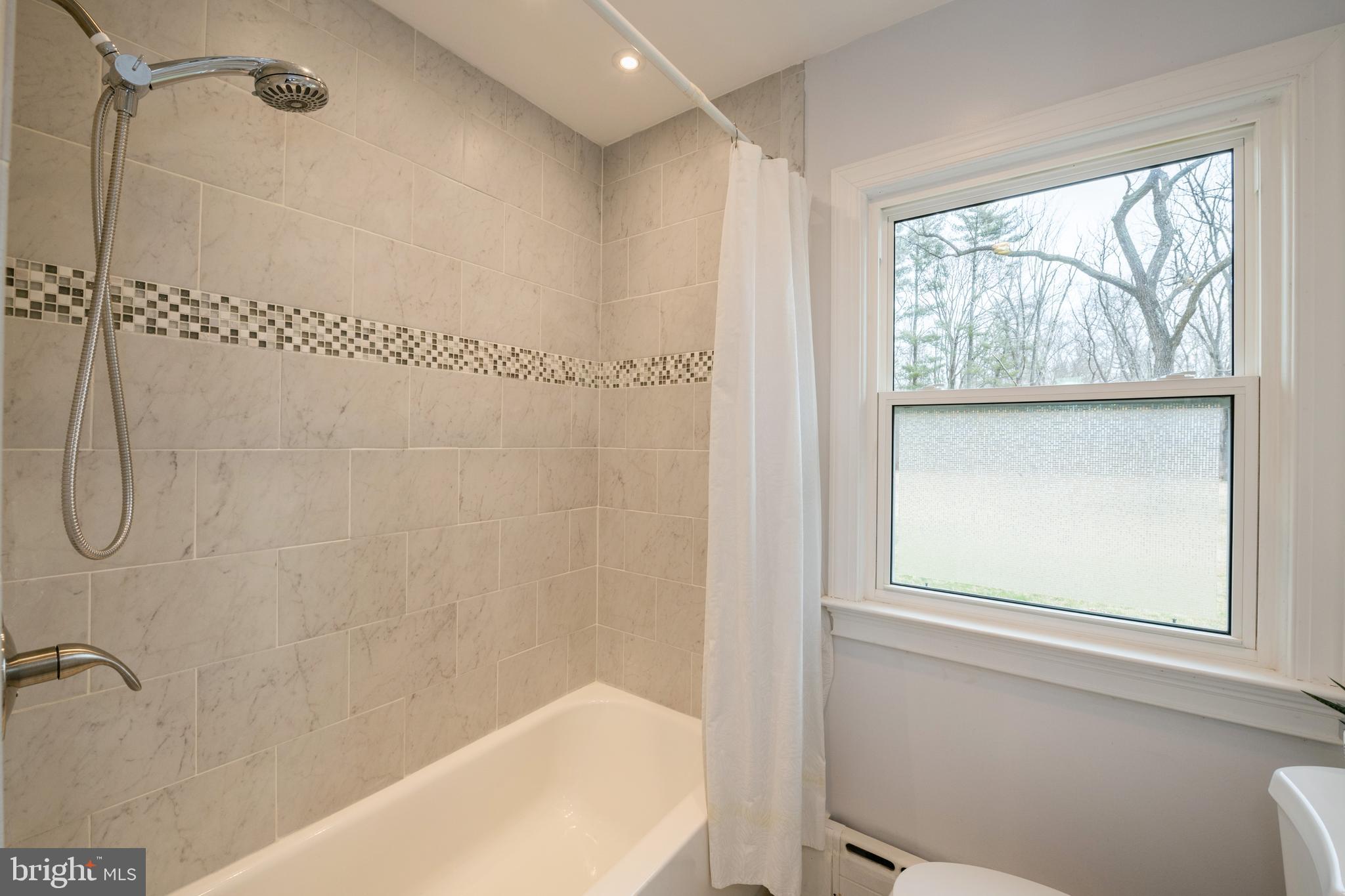 184 Carter Road Princeton, NJ 08540 - Photo 16 of 34 a bathroom with a bathtub and a shower