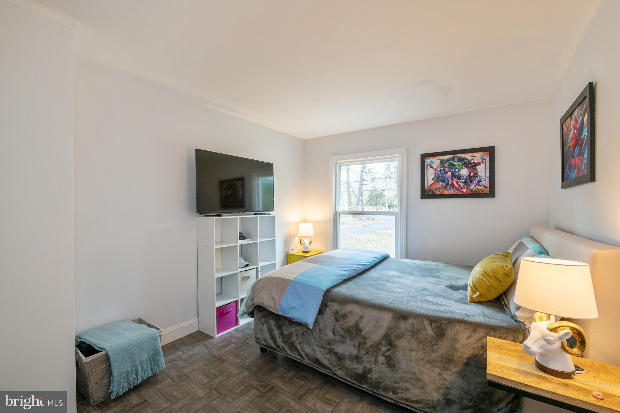 184 Carter Road Princeton, NJ 08540 - Photo 5 of 34 a bedroom with a bed and a flat screen tv