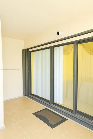 a view of a room with a large window