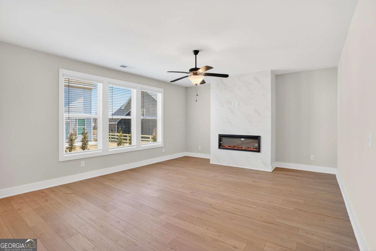 613 Villa Rica Springs Villa Rica, GA 30180 - Photo 11 of 40 a view of an empty room with a window and wooden floor