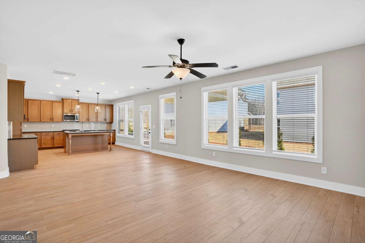 613 Villa Rica Springs Villa Rica, GA 30180 - Photo 13 of 40 a view of an empty room with wooden floor and a window