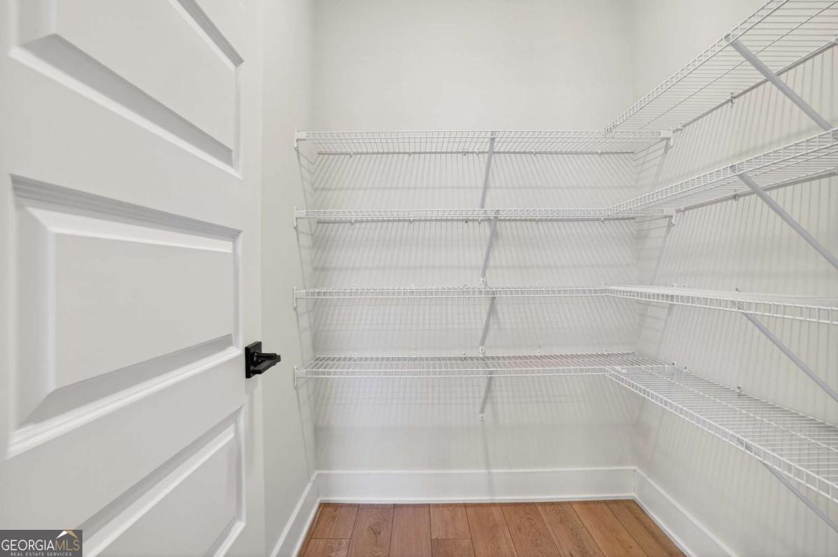 613 Villa Rica Springs Villa Rica, GA 30180 - Photo 19 of 40 a view of walk in closet with empty racks