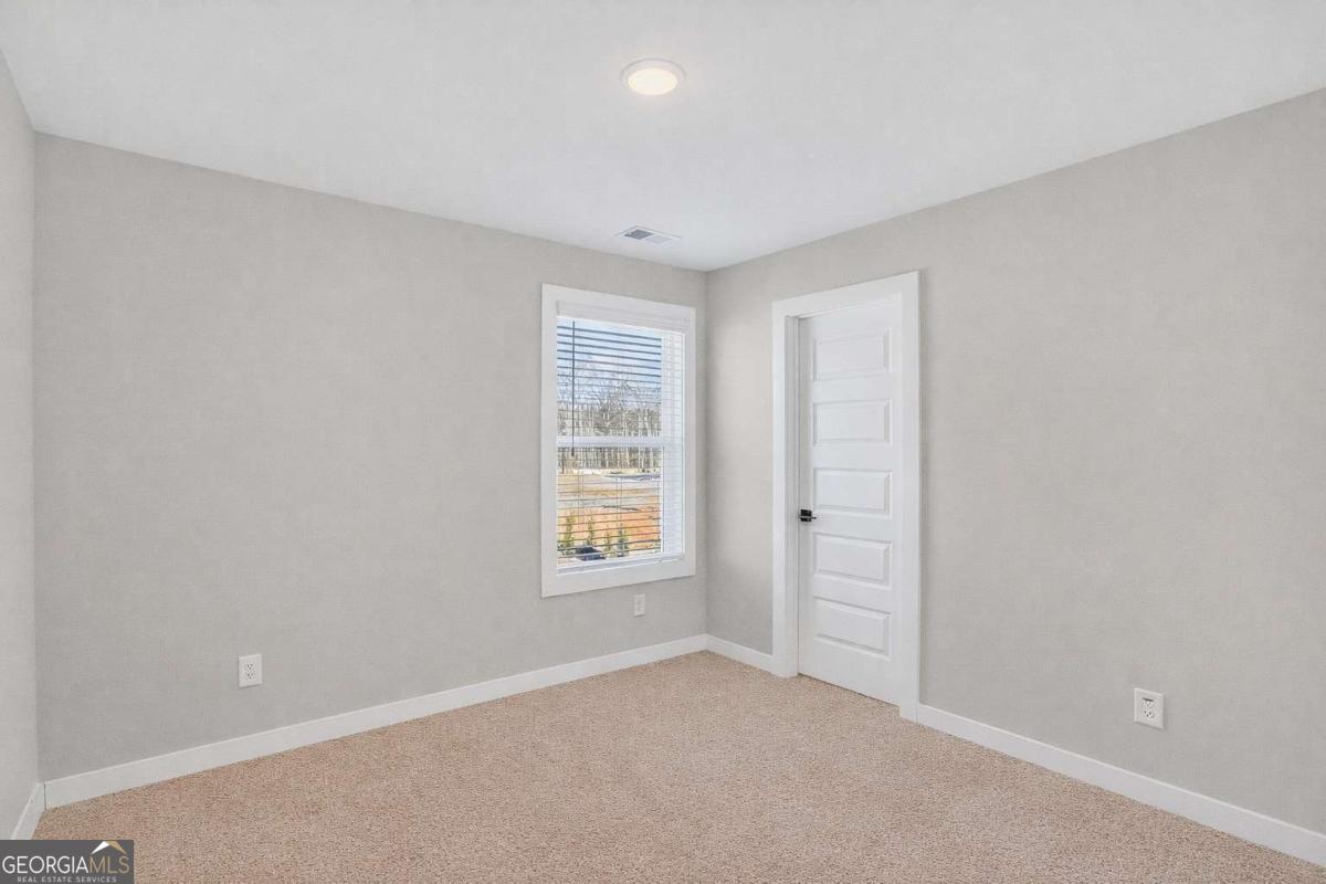 613 Villa Rica Springs Villa Rica, GA 30180 - Photo 23 of 40 an empty room with windows and closet