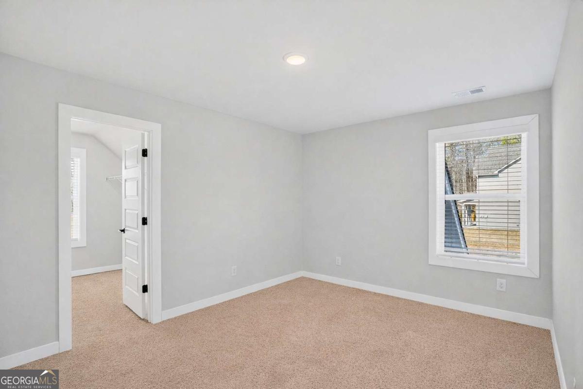 613 Villa Rica Springs Villa Rica, GA 30180 - Photo 27 of 40 an empty room with windows and closet