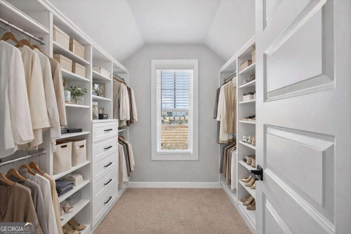 613 Villa Rica Springs Villa Rica, GA 30180 - Photo 28 of 40 a view of walk in closet with clothes and shoes