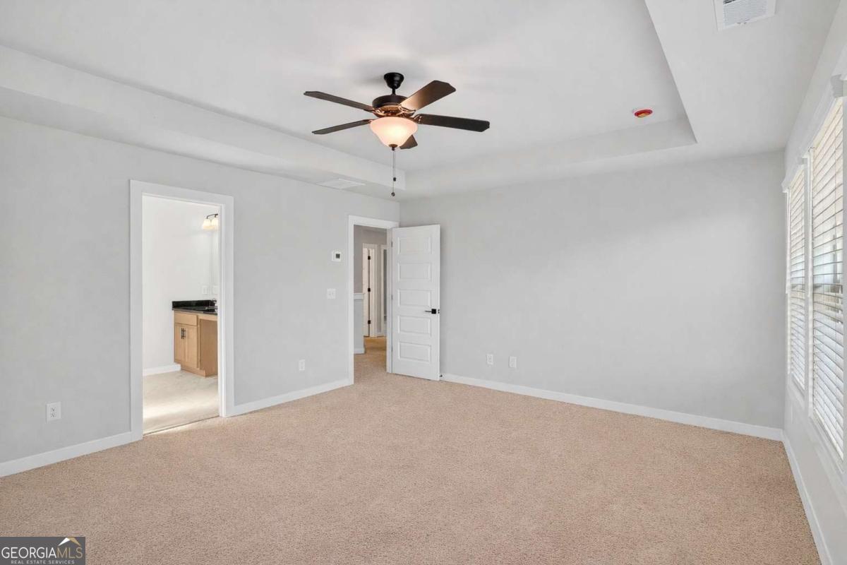 613 Villa Rica Springs Villa Rica, GA 30180 - Photo 29 of 40 a view of a livingroom with a ceiling fan and window