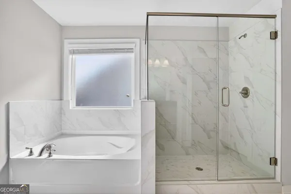 a bathroom with a shower and a sink