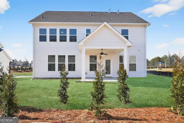 a front view of a house with yard