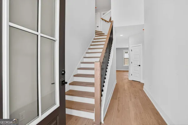 a view of entryway with wooden floor