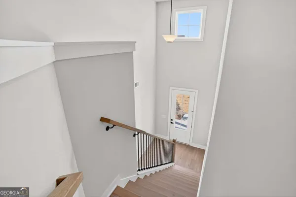 a view of a hallway with staircase