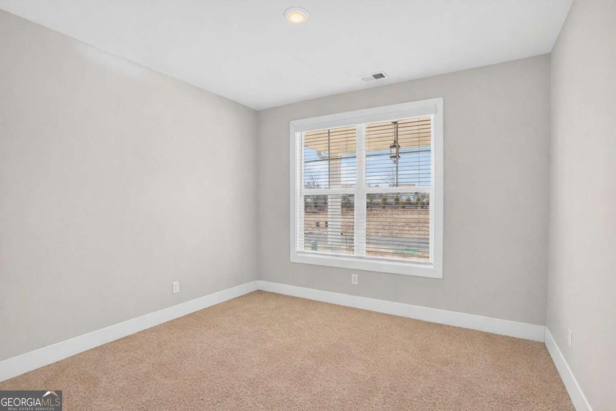 613 Villa Rica Springs Villa Rica, GA 30180 - Photo 9 of 40 an empty room with a window