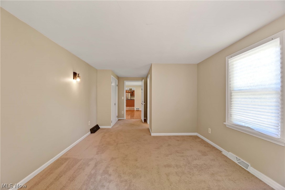 29514 Ridge Road Wickliffe, OH 44092 - Photo 34 of 49 Carpeted primary bedroom with a wealth of natural light