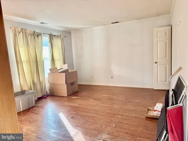a living room with furniture and large window