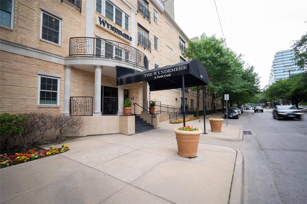 3400 Welborn Street, Unit 322 Dallas, TX 75219 - Photo 1 of 1 a view of a building with sitting area and potted plants