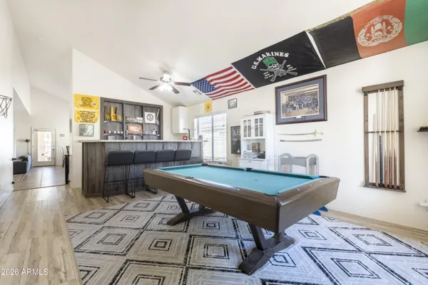 a room with furniture and pool table