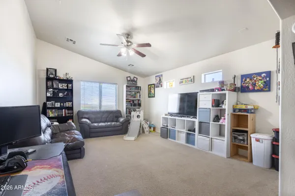 a view of a livingroom with furniture and a window