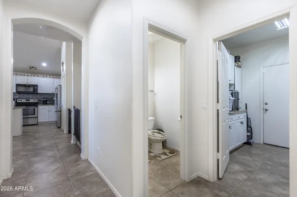a view of a hallway with a kitchen