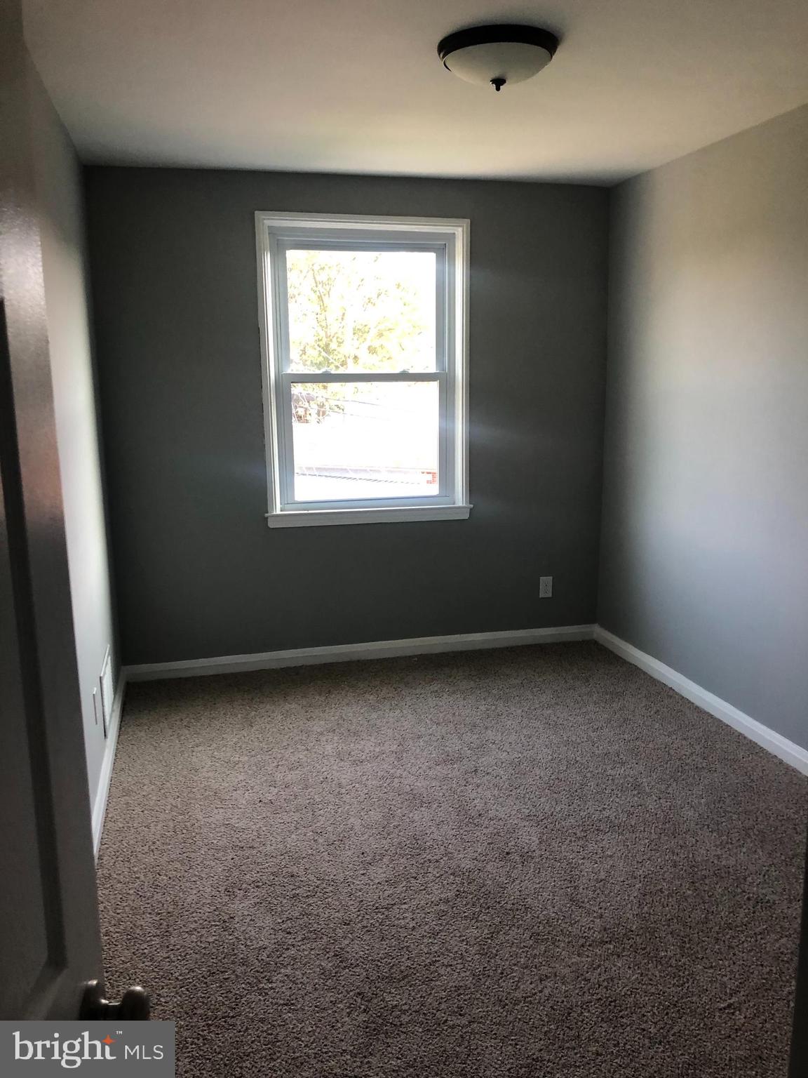 7441 Edsworth Road Baltimore, MD 21222 - Photo 34 of 37 an empty room with a window