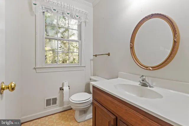 a bathroom with a sink a mirror and a toilet