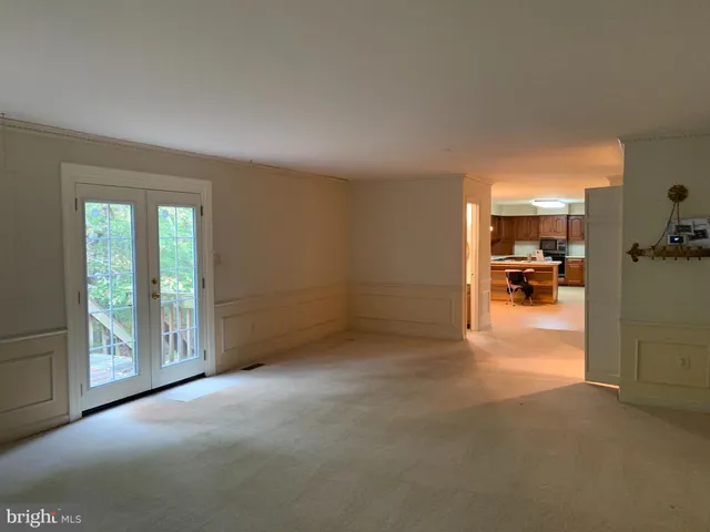 a view of a livingroom with furniture and a window