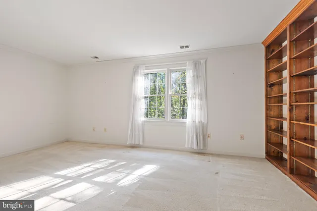 a view of room with window and stairs