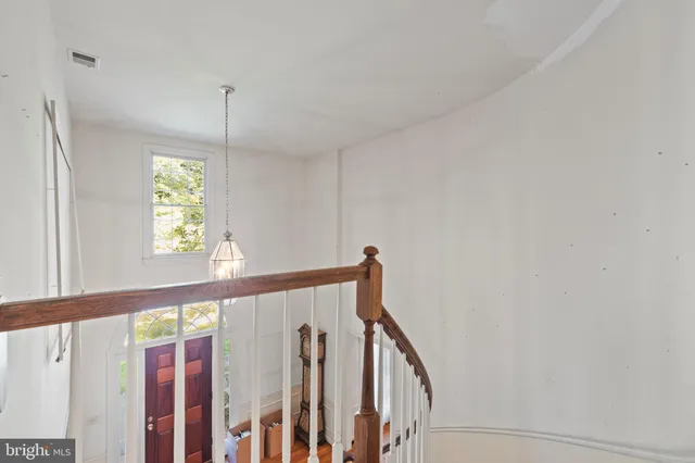 a view of an entryway with wooden floor