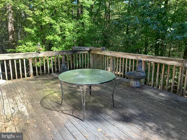 a view of a chairs and table on the wooden floor