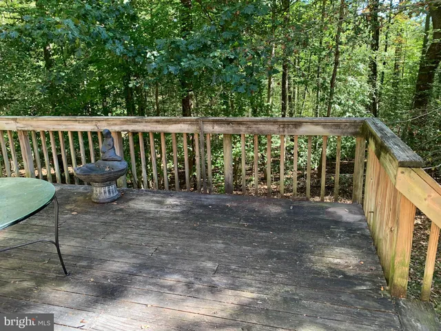 a view of outdoor space with deck and furniture
