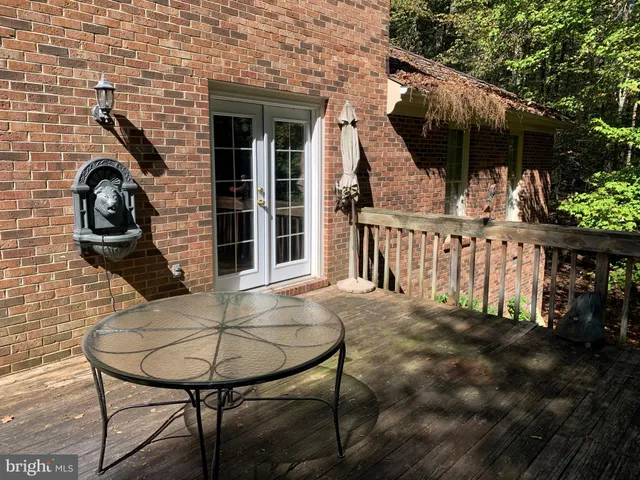 a view of a house with backyard and porch
