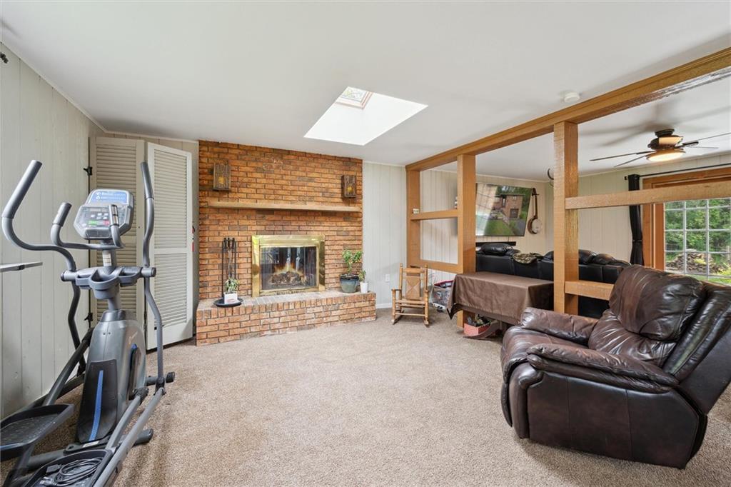 233 Valley Road Canonsburg, PA 15317 - Photo 14 of 39 a living room with furniture a large window and gym equipment