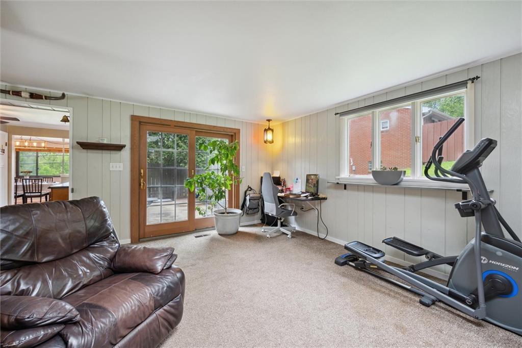 233 Valley Road Canonsburg, PA 15317 - Photo 16 of 39 a living room with furniture gym equipment and a large window