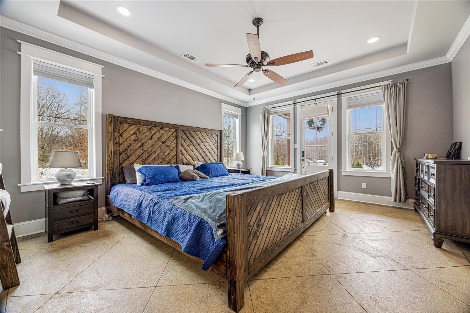 897 Burrowtown Road Mason, TN 38049 - Photo 13 of 36 Bedroom featuring a ceiling fan, a tray ceiling, recessed lighting, and ornamental molding