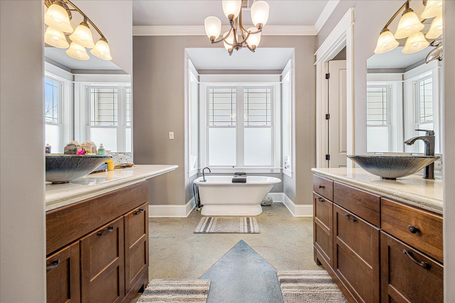 897 Burrowtown Road Mason, TN 38049 - Photo 15 of 36 Full bath featuring two vanities, a chandelier, a freestanding bath, healthy amount of natural light, and ornamental molding