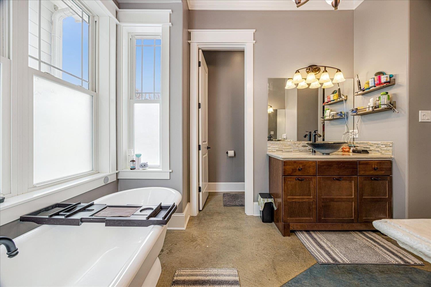 897 Burrowtown Road Mason, TN 38049 - Photo 17 of 36 Bathroom with a freestanding bath and vanity