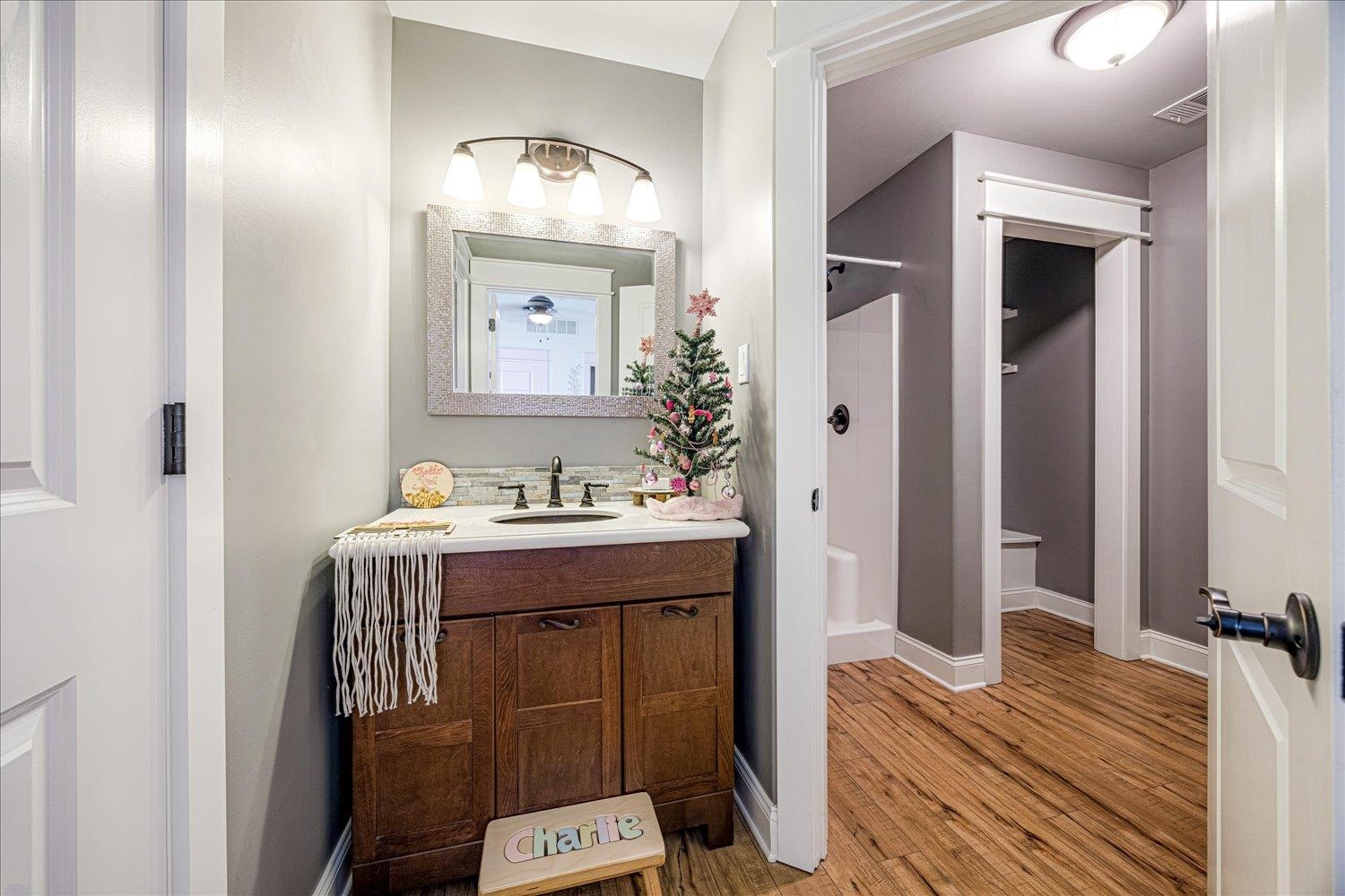 897 Burrowtown Road Mason, TN 38049 - Photo 21 of 36 Full bathroom featuring vanity, a stall shower, and light wood-style flooring