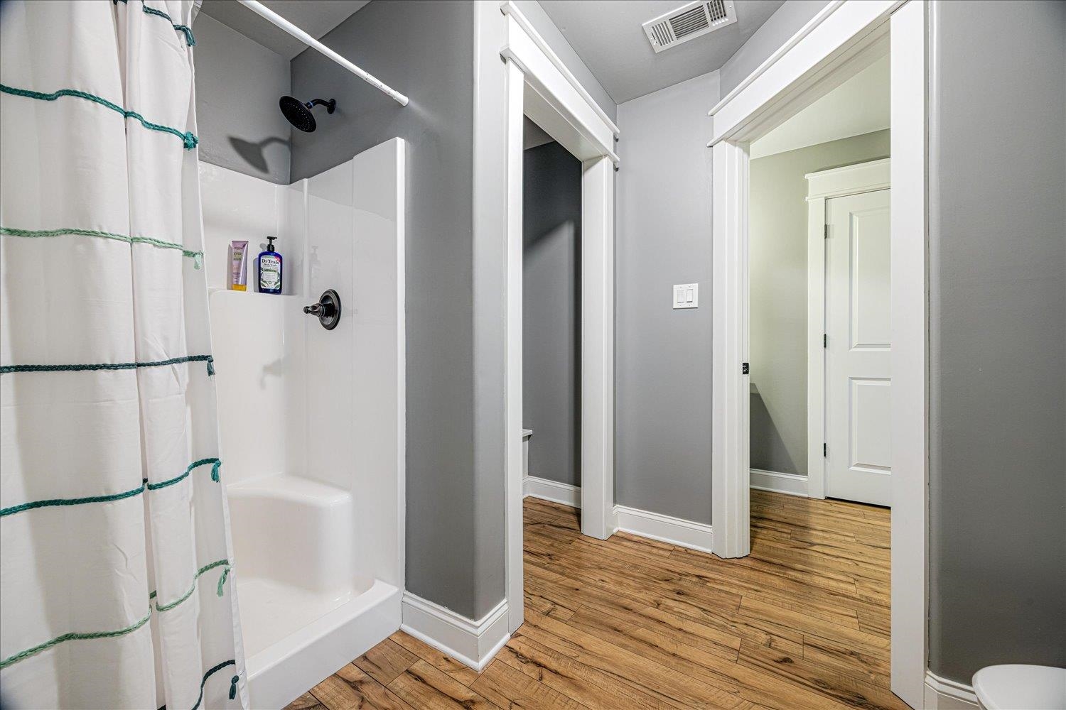 897 Burrowtown Road Mason, TN 38049 - Photo 22 of 36 Bathroom featuring a stall shower and light wood finished floors