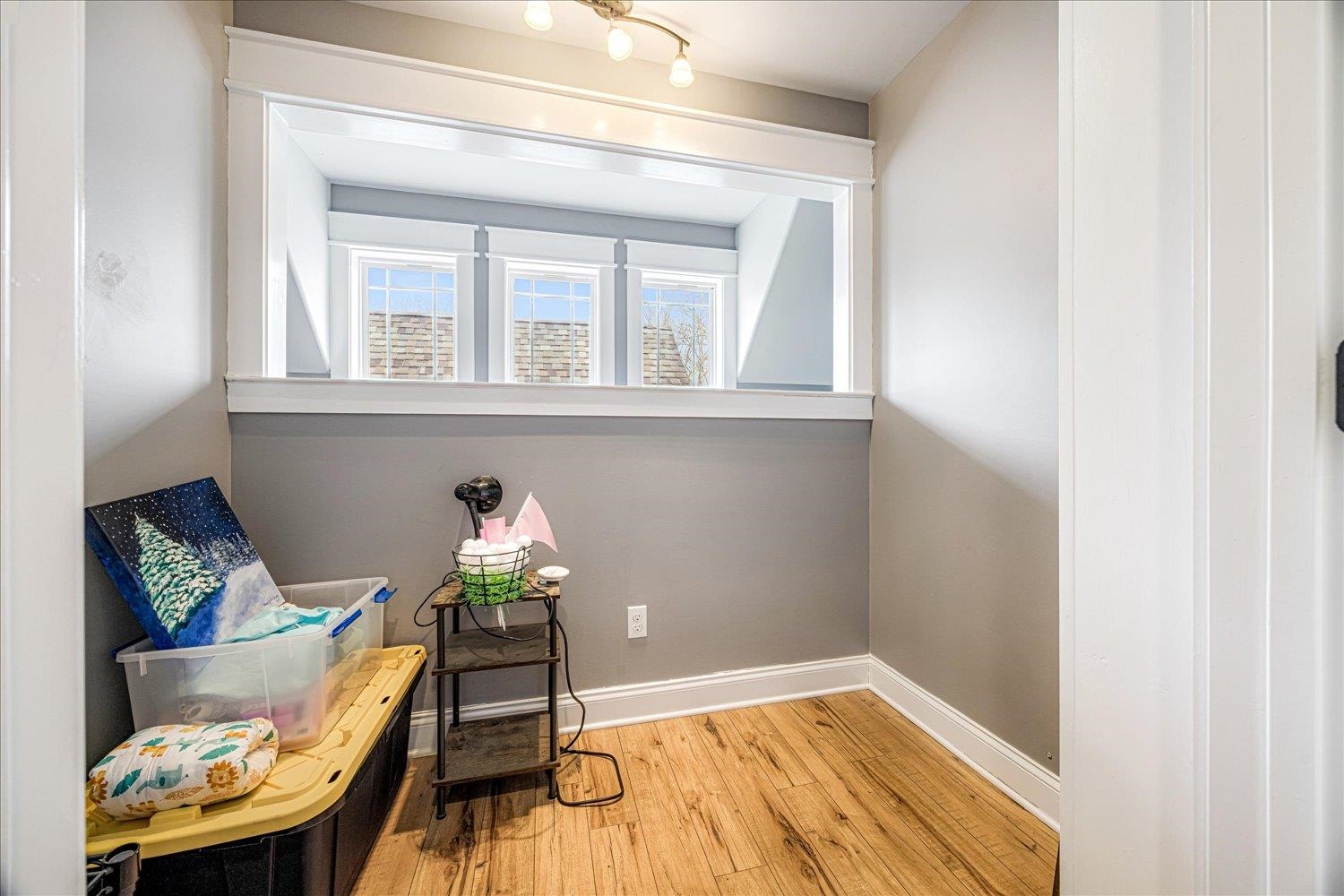 897 Burrowtown Road Mason, TN 38049 - Photo 23 of 36 Living area with baseboards and light wood finished floors