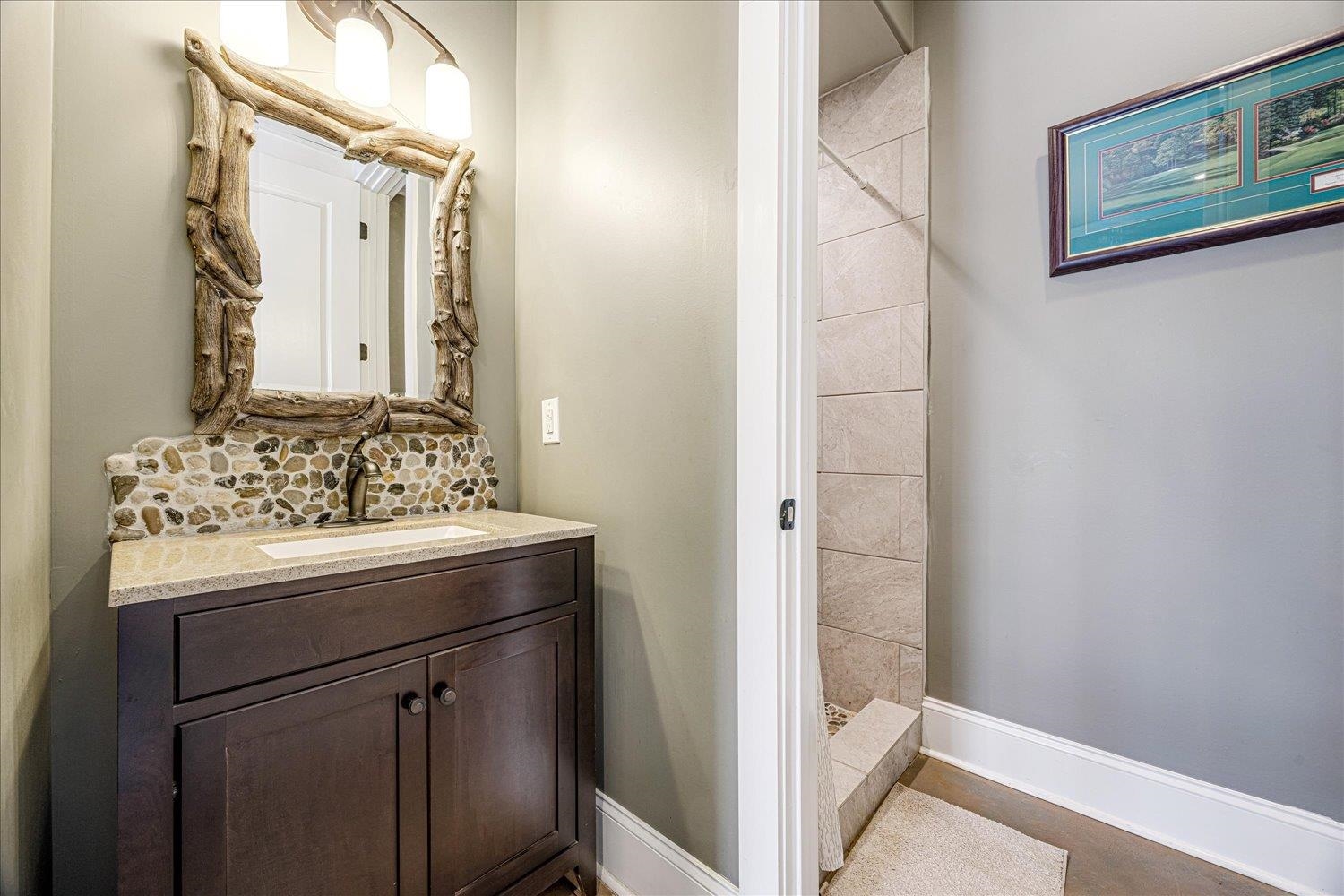 897 Burrowtown Road Mason, TN 38049 - Photo 26 of 36 Bathroom featuring vanity and a tile shower