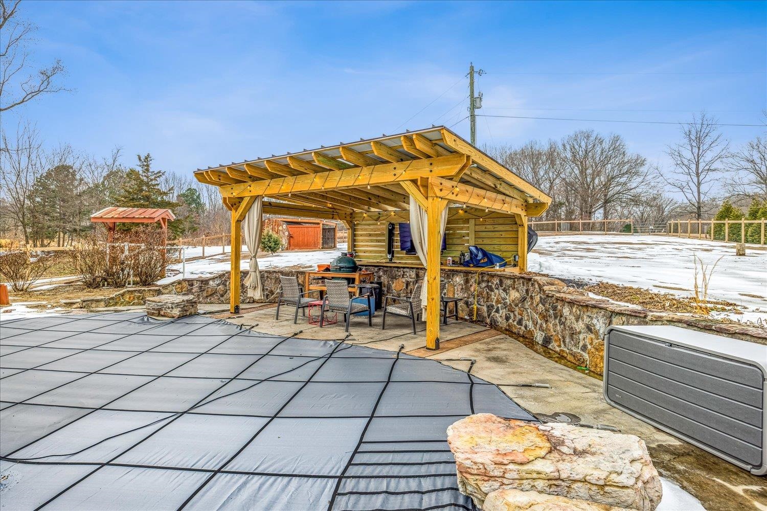 897 Burrowtown Road Mason, TN 38049 - Photo 29 of 36 Snow covered patio featuring a patio