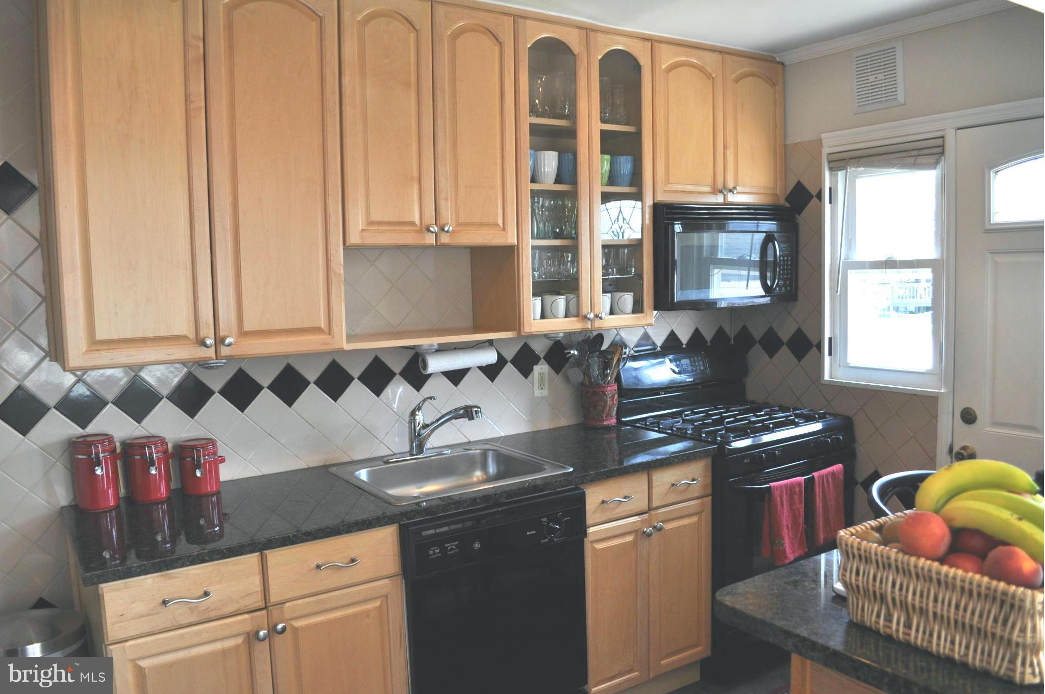 2041 Inverton Road Baltimore, MD 21222 - Photo 2 of 27 a kitchen with granite countertop a sink and a stove