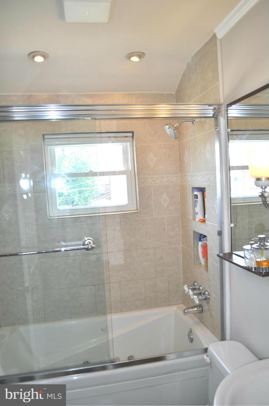 2041 Inverton Road Baltimore, MD 21222 - Photo 11 of 27 a bathroom with a bathtub and a shower