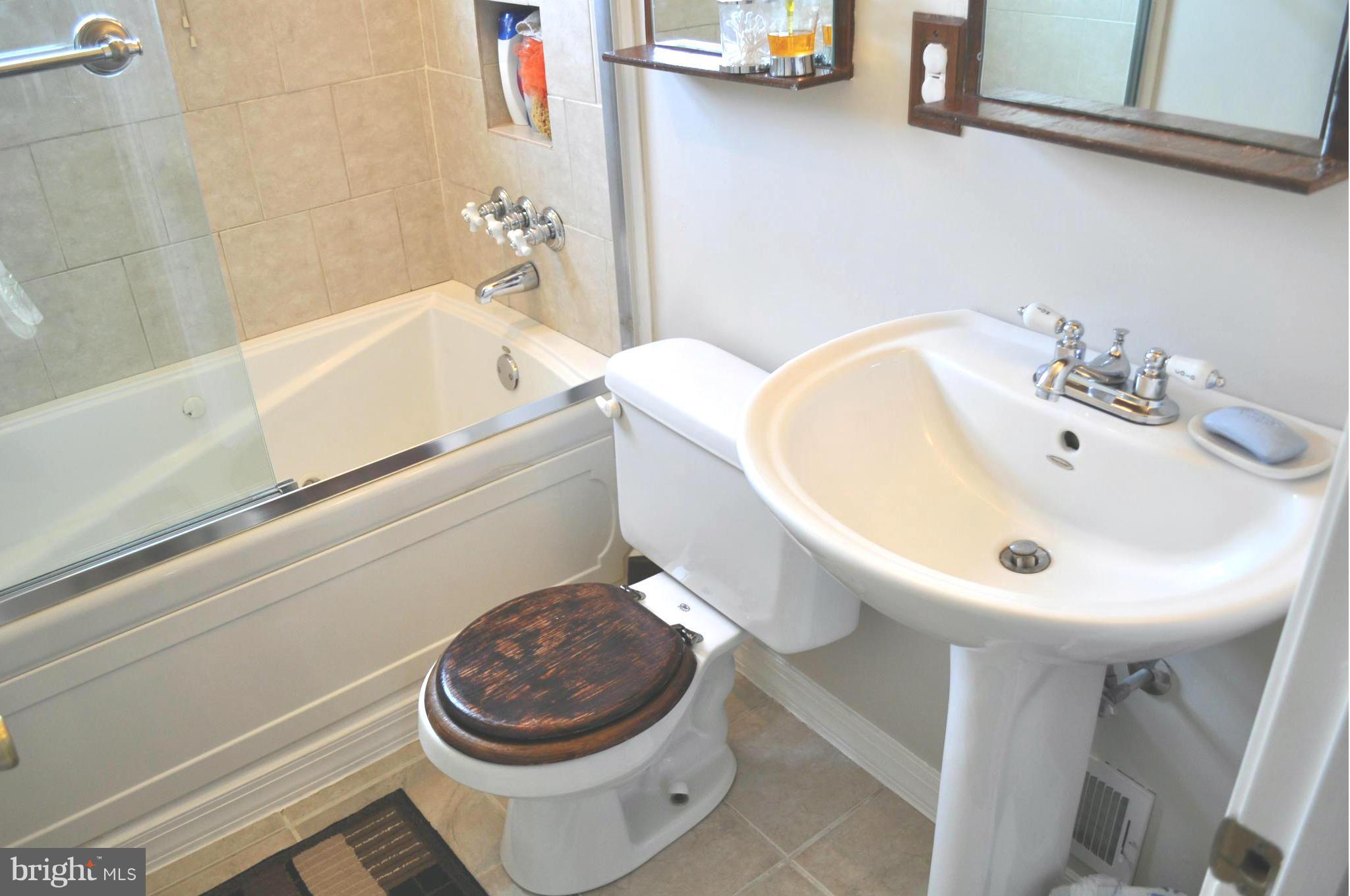 2041 Inverton Road Baltimore, MD 21222 - Photo 12 of 27 a bathroom with a sink and a toilet