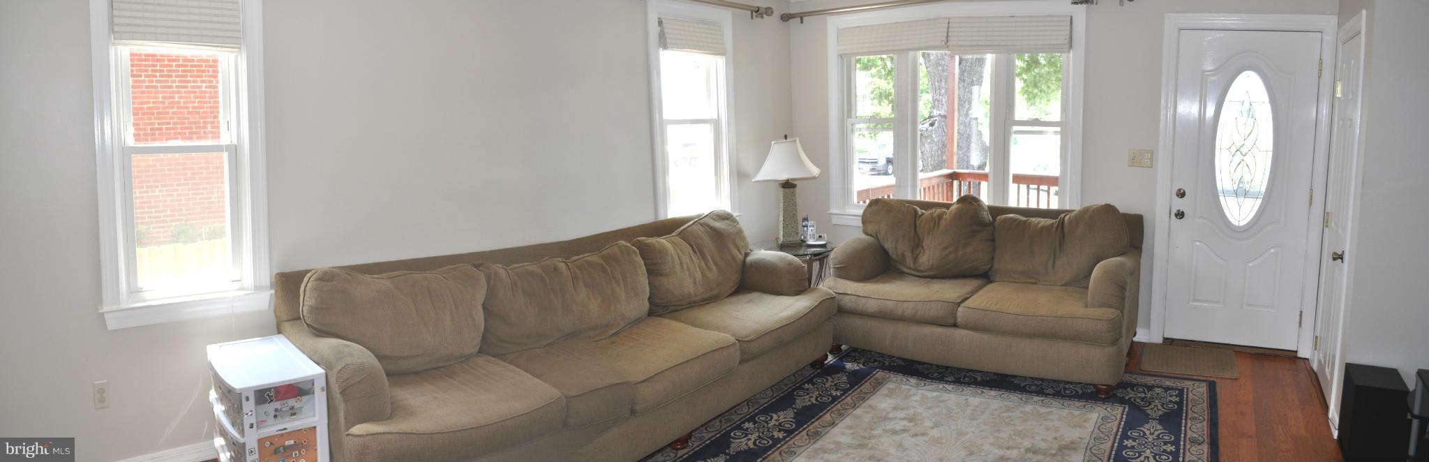2041 Inverton Road Baltimore, MD 21222 - Photo 9 of 27 a living room with furniture and a window