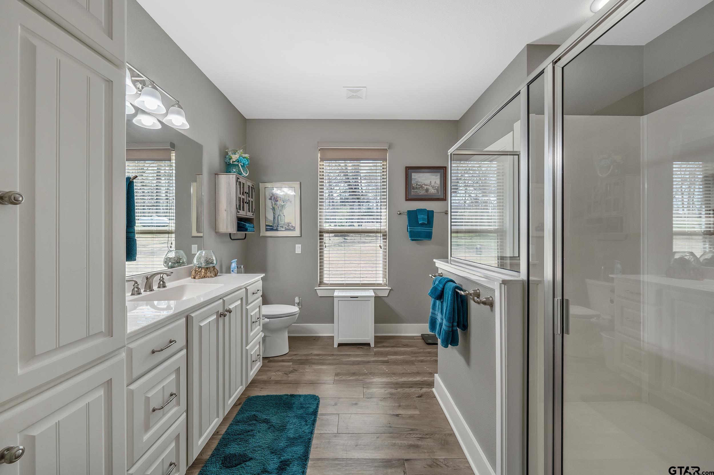 10918 Spring Club Lake Tyler, TX 75706 - Photo 13 of 23 a large kitchen with a lot of counter space and windows