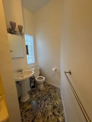 a bathroom with a sink and a toilet