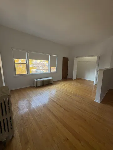 a view of an empty room and window