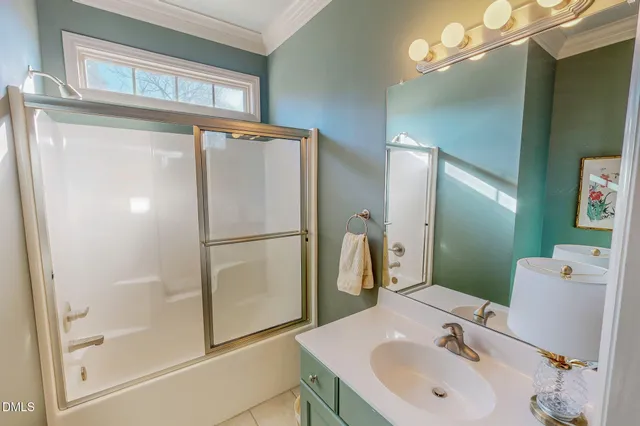 a bathroom with a sink a mirror and a shower