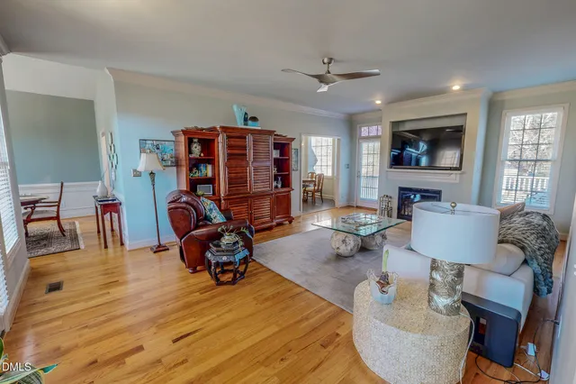 a view of a livingroom with furniture and a flat screen tv