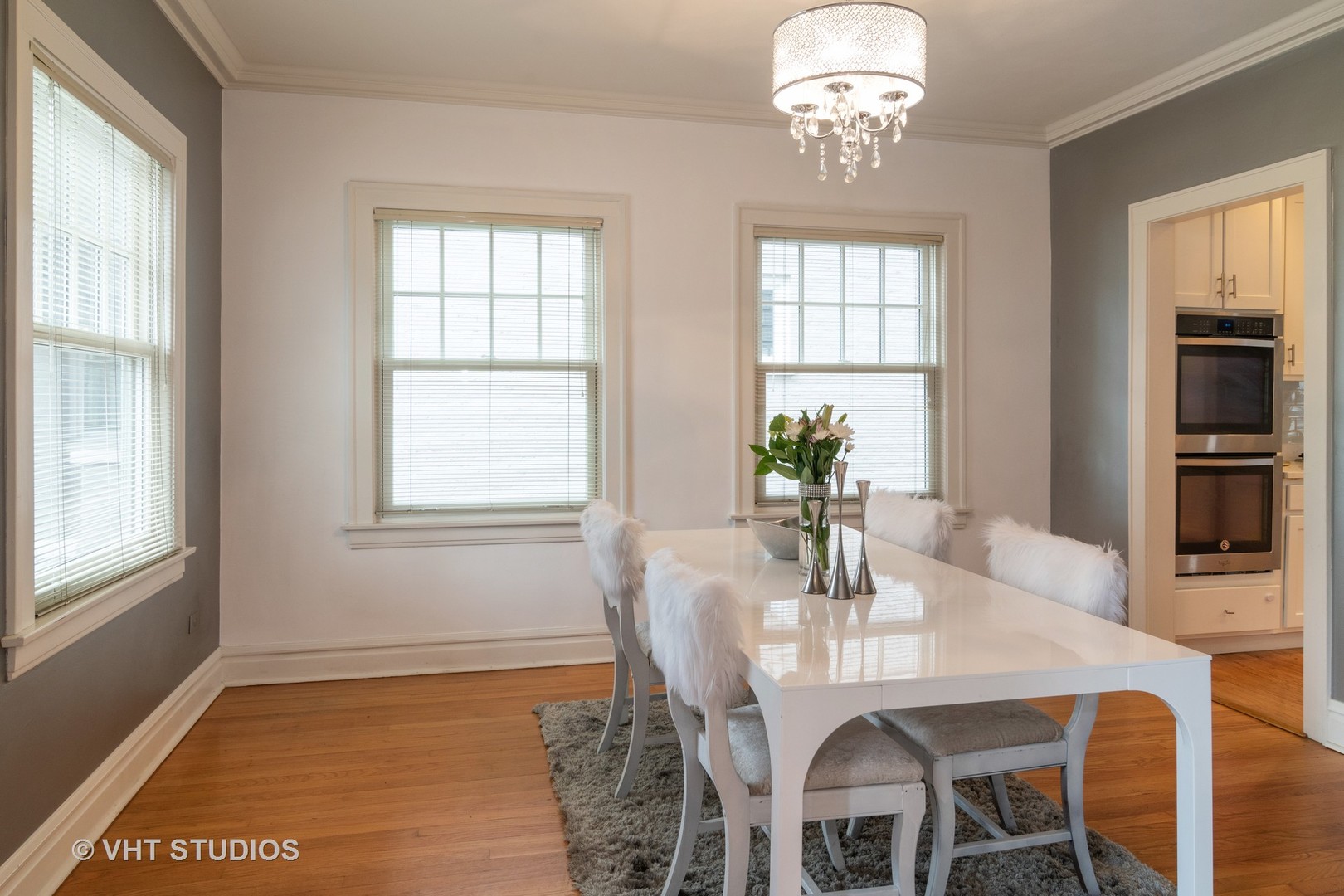 330 Northwood Road Riverside, IL 60546 - Photo 7 of 22 a view of a dining room with furniture a chandelier and wooden floor