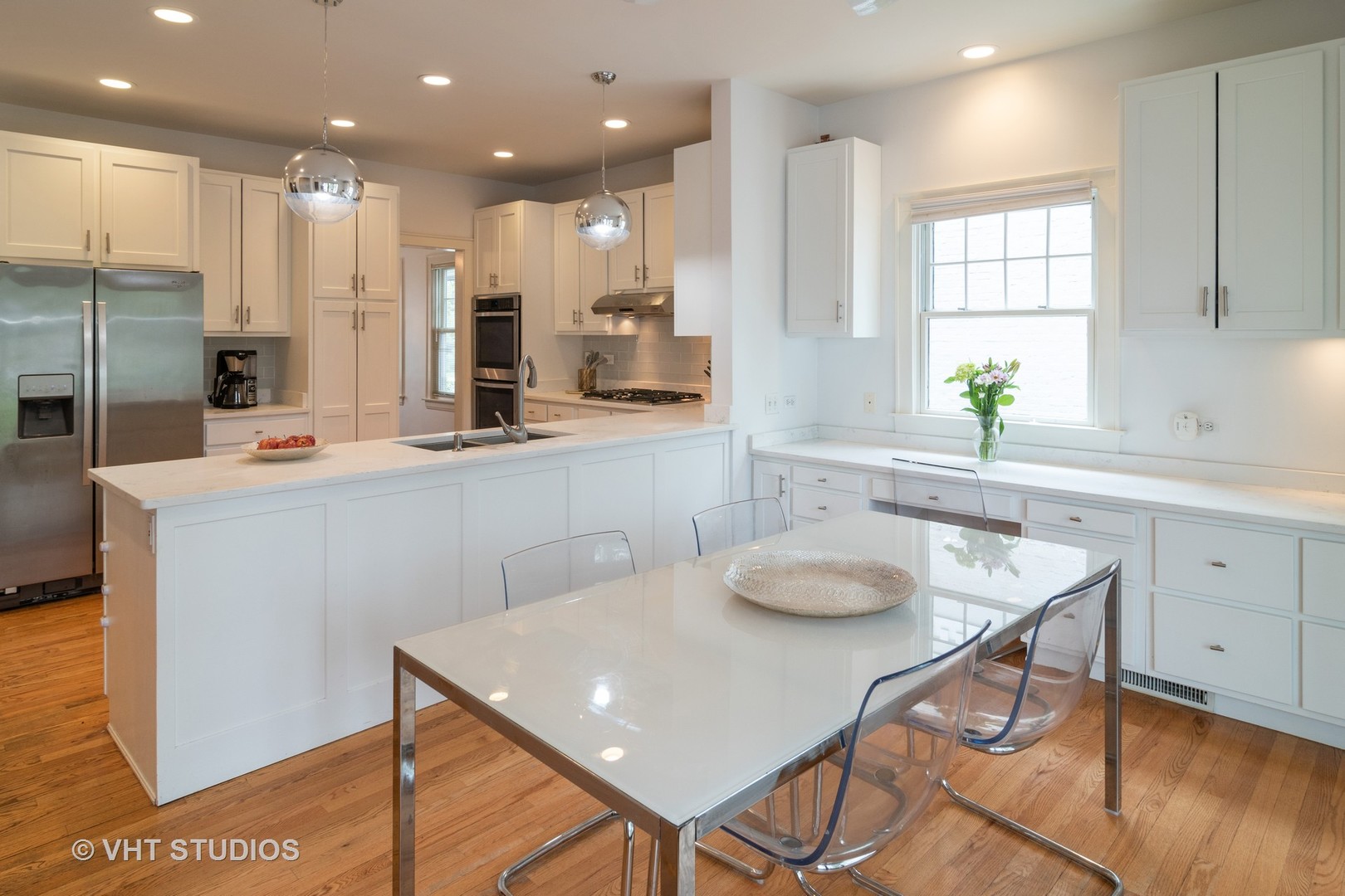 330 Northwood Road Riverside, IL 60546 - Photo 10 of 22 a kitchen with stainless steel appliances granite countertop a sink a stove a refrigerator cabinets and chairs